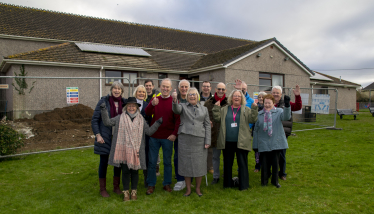 Sheryll celebrating with the team from Menheniot Village Hall 